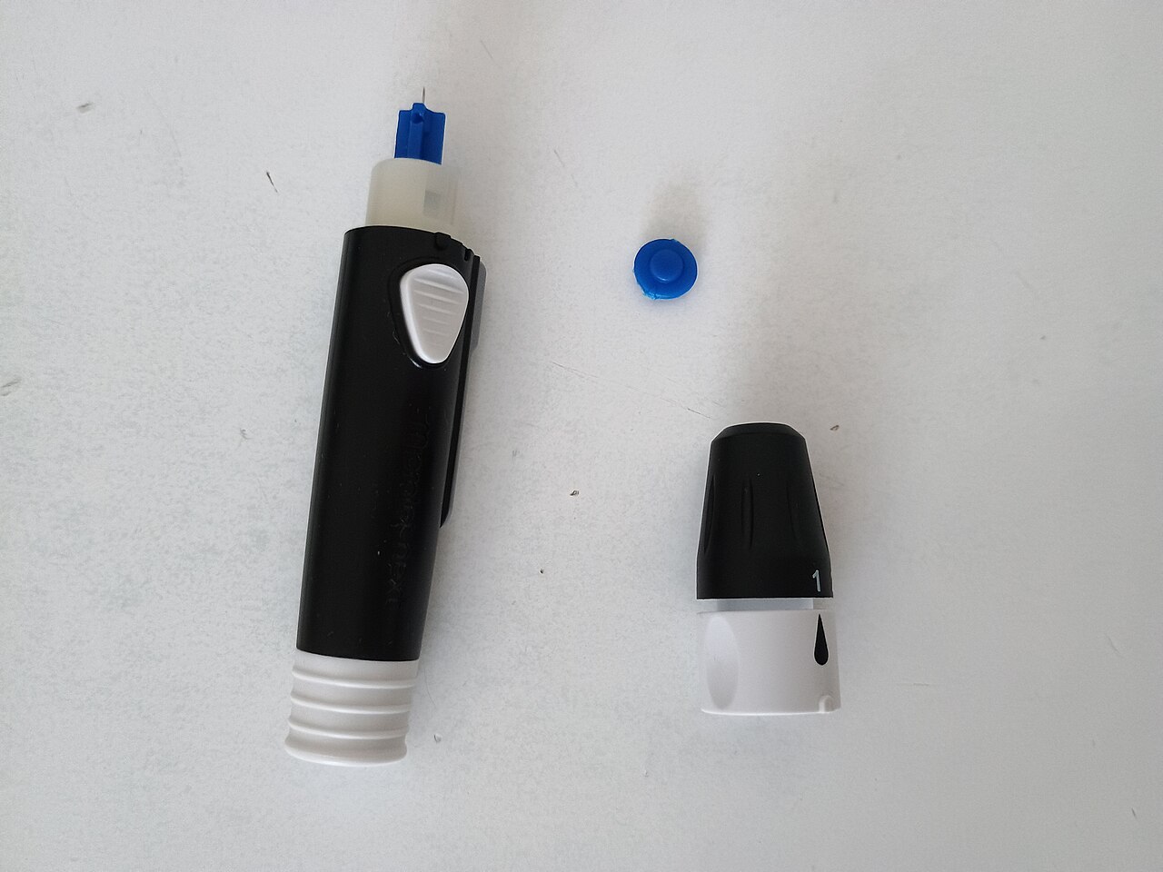 Blood sugar monitor with a test strip inserted into the port