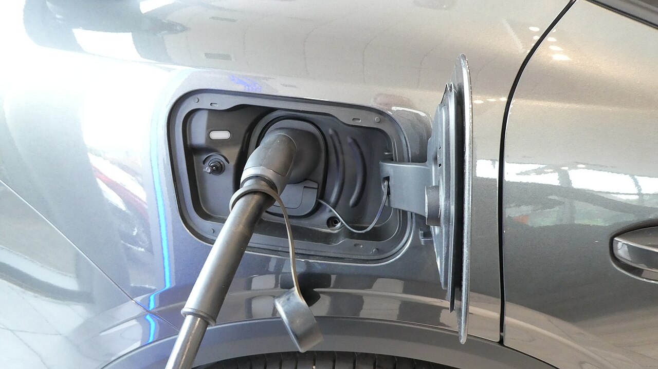 Type 2 charging connector plugged into the charging socket of a car