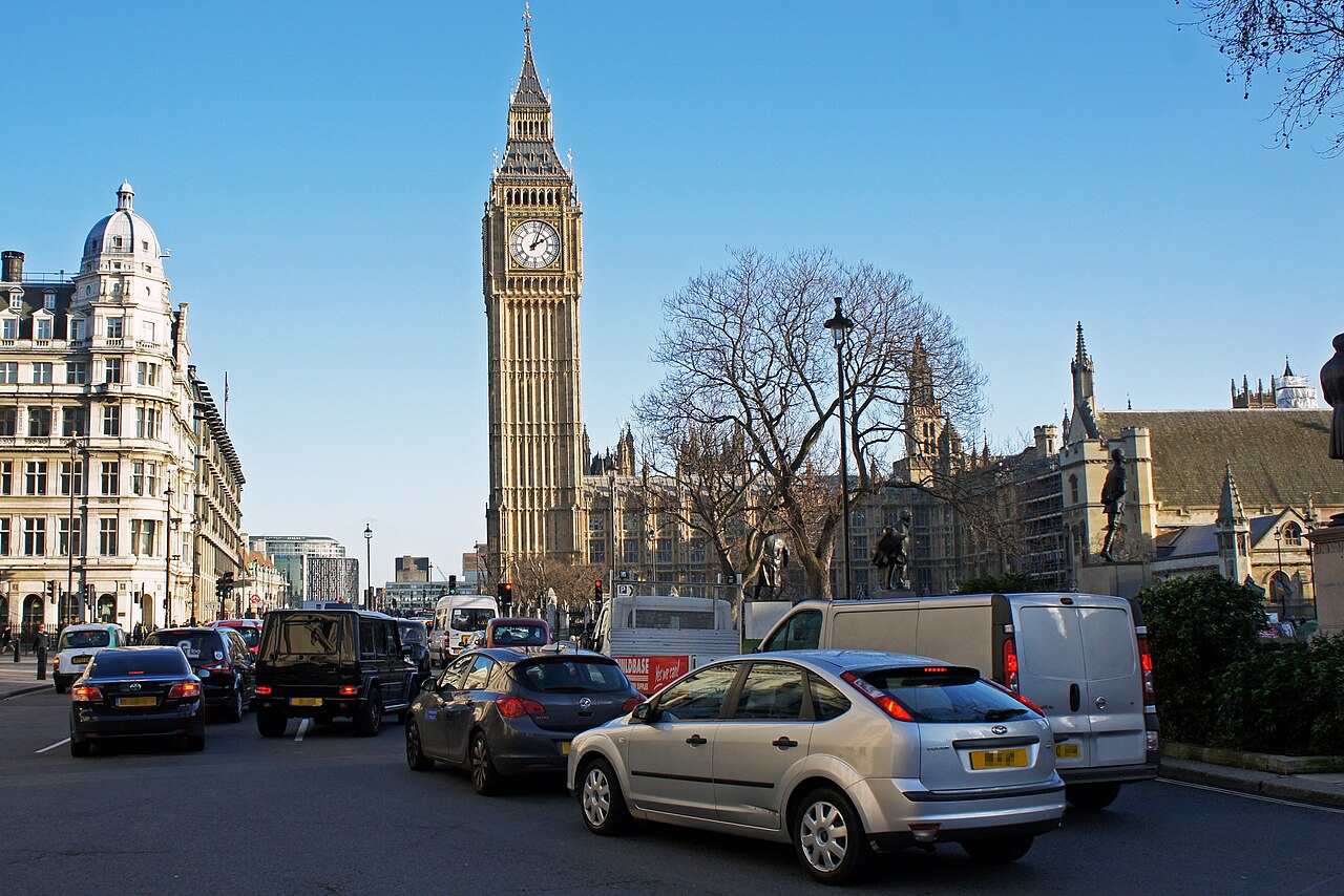 Queuing cars and buses on a congested London street near the Palace of Westminster