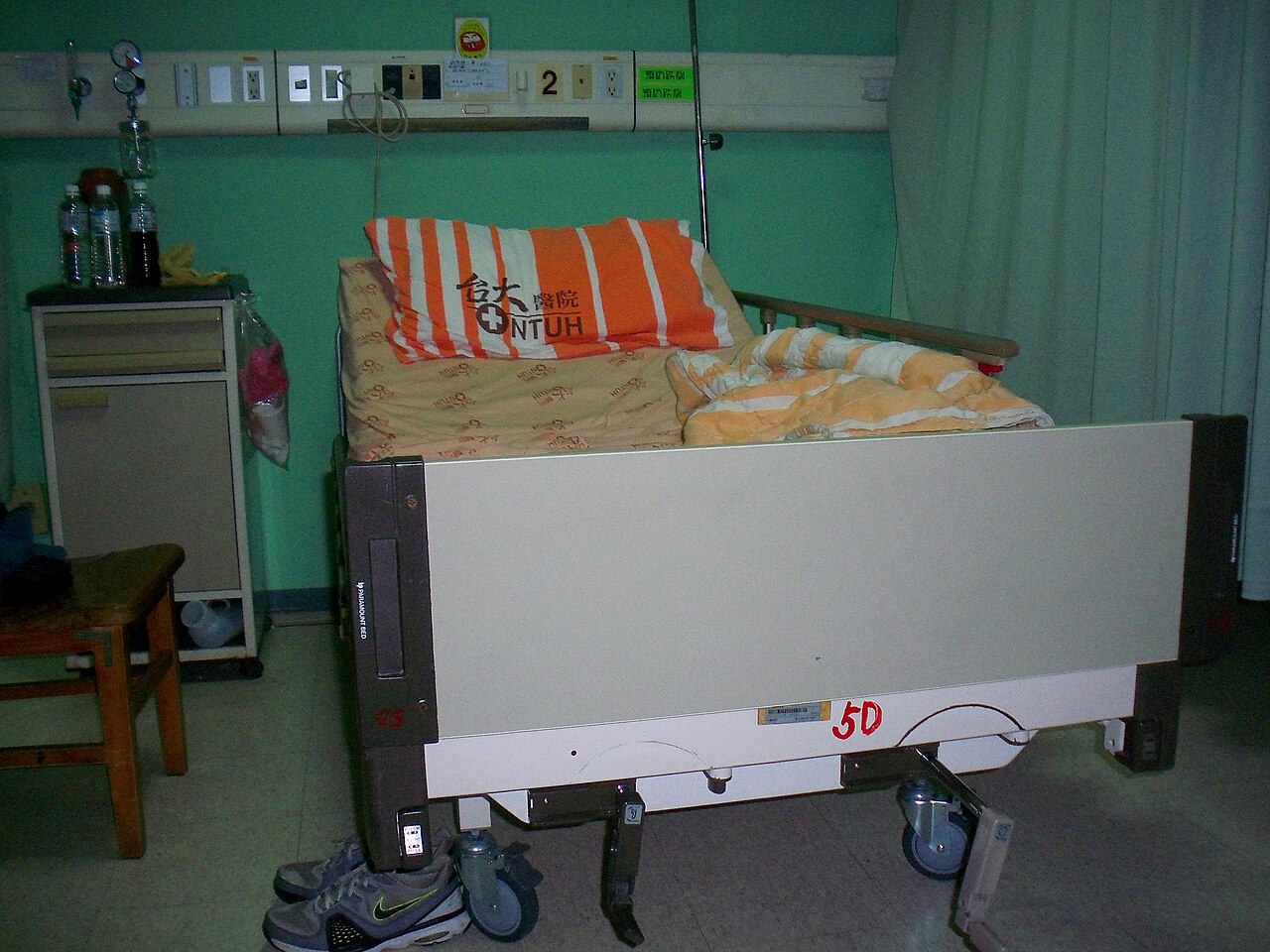 Made-up bed in a three-person internal medicine ward room
