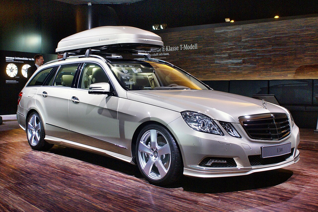 Large estate car fitted with a roof box on its roof rails