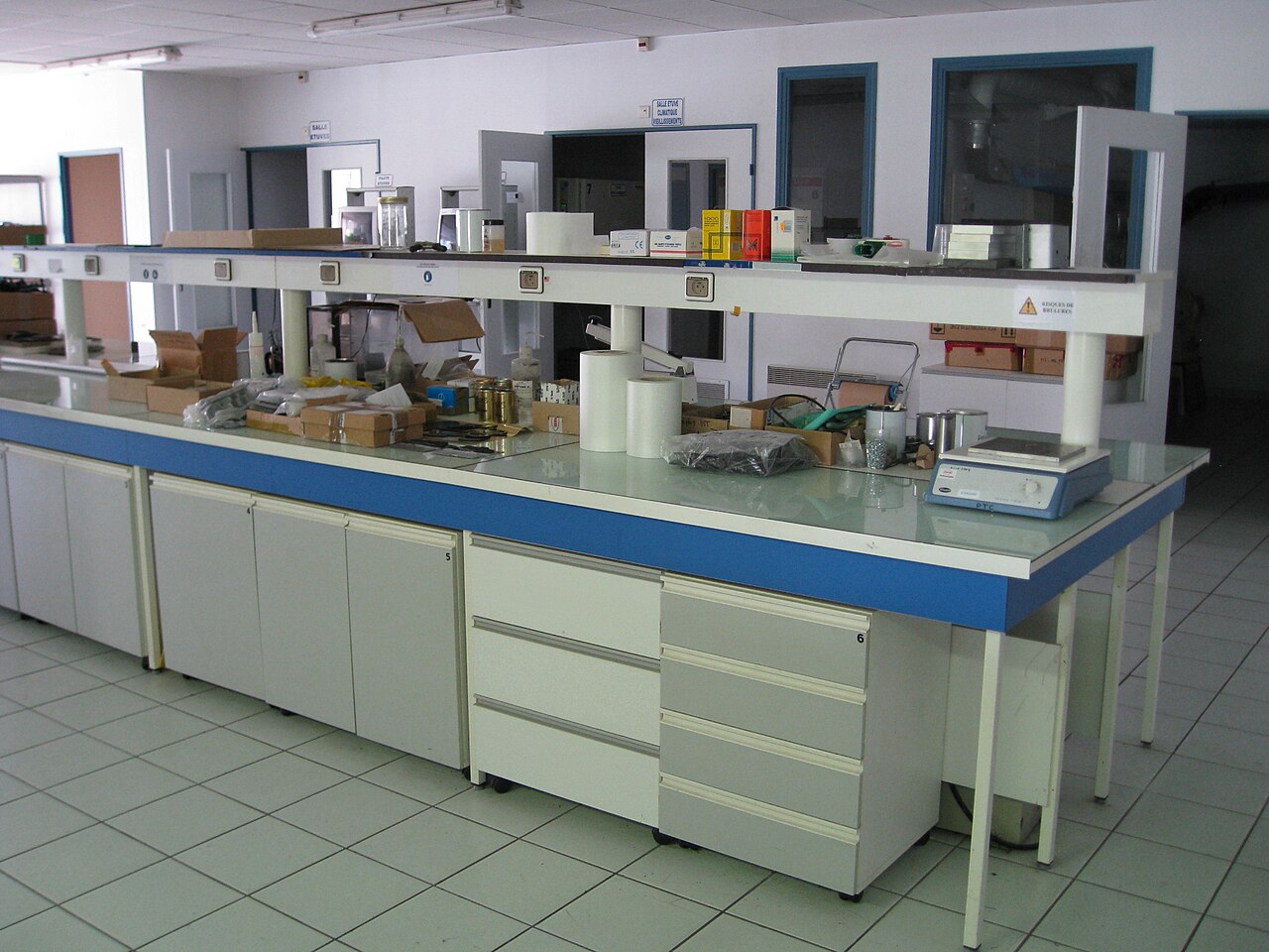 Chemistry laboratory bench with glassware and reagent bottles in place