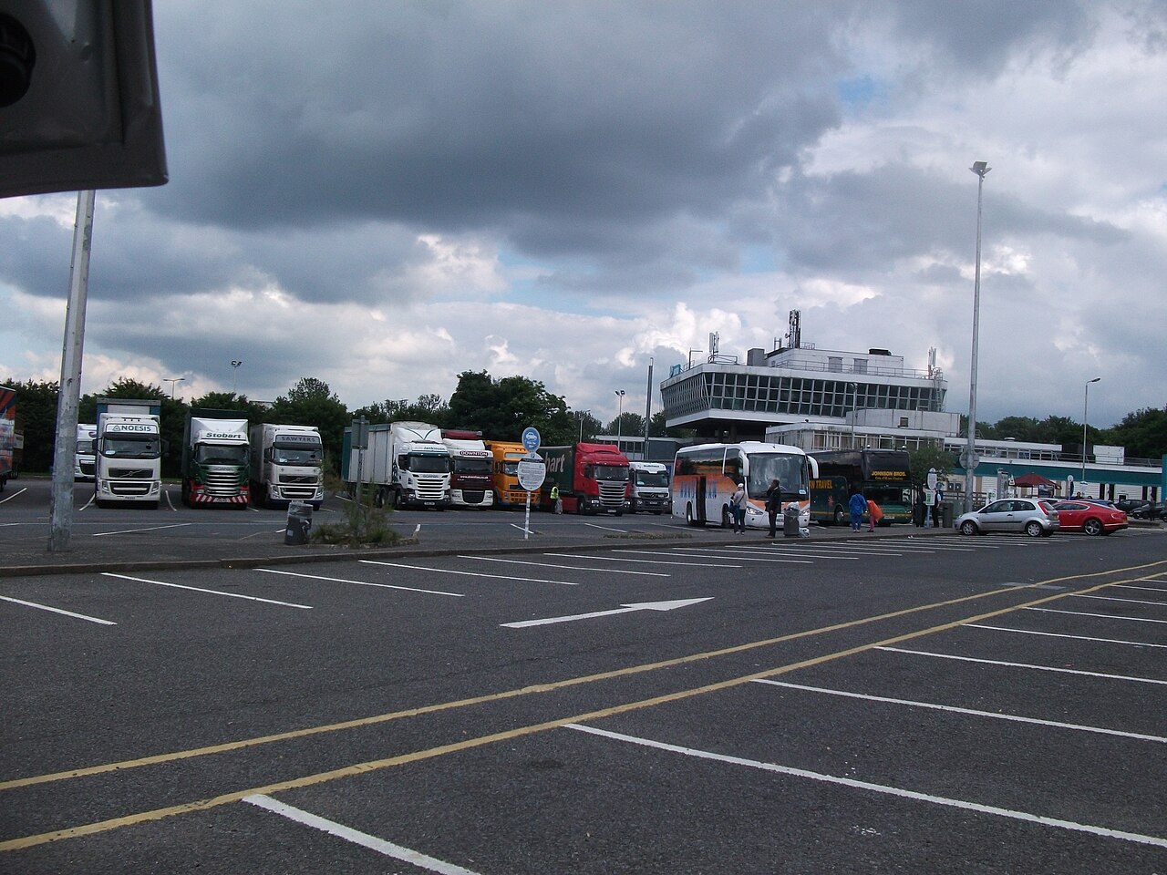 Service area on the M6 with parking bays and a filling station beyond
