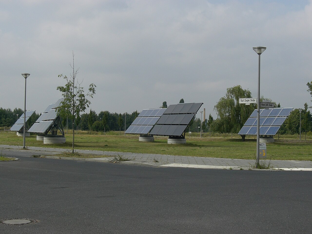 Ground-mounted solar array photographed along the rows of panels