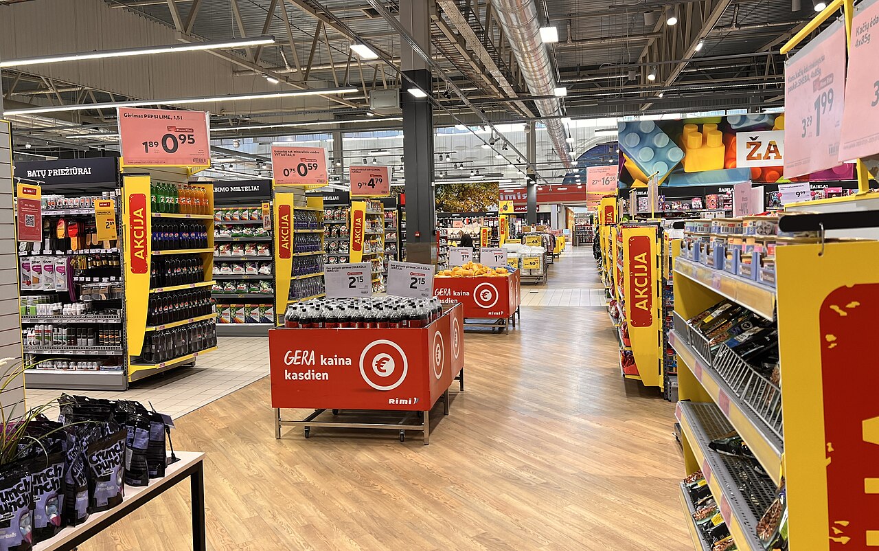 Long stocked aisle inside a Rimi supermarket in Kaunas, Lithuania