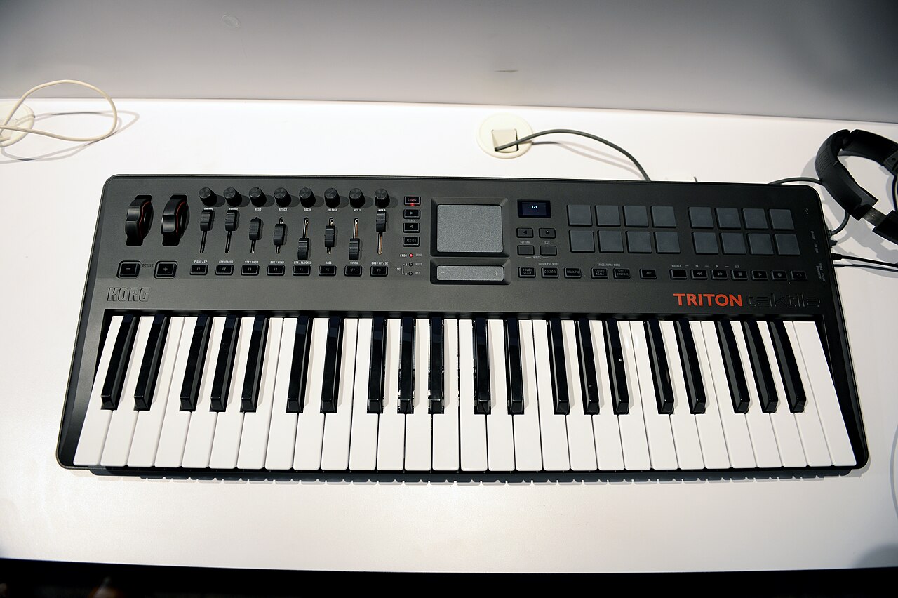 Controller keyboard with full-size keys, pads and a small display panel