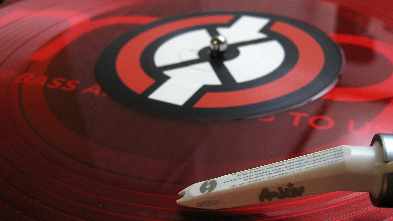 Timecode control record sitting on a turntable platter with the tonearm lowered