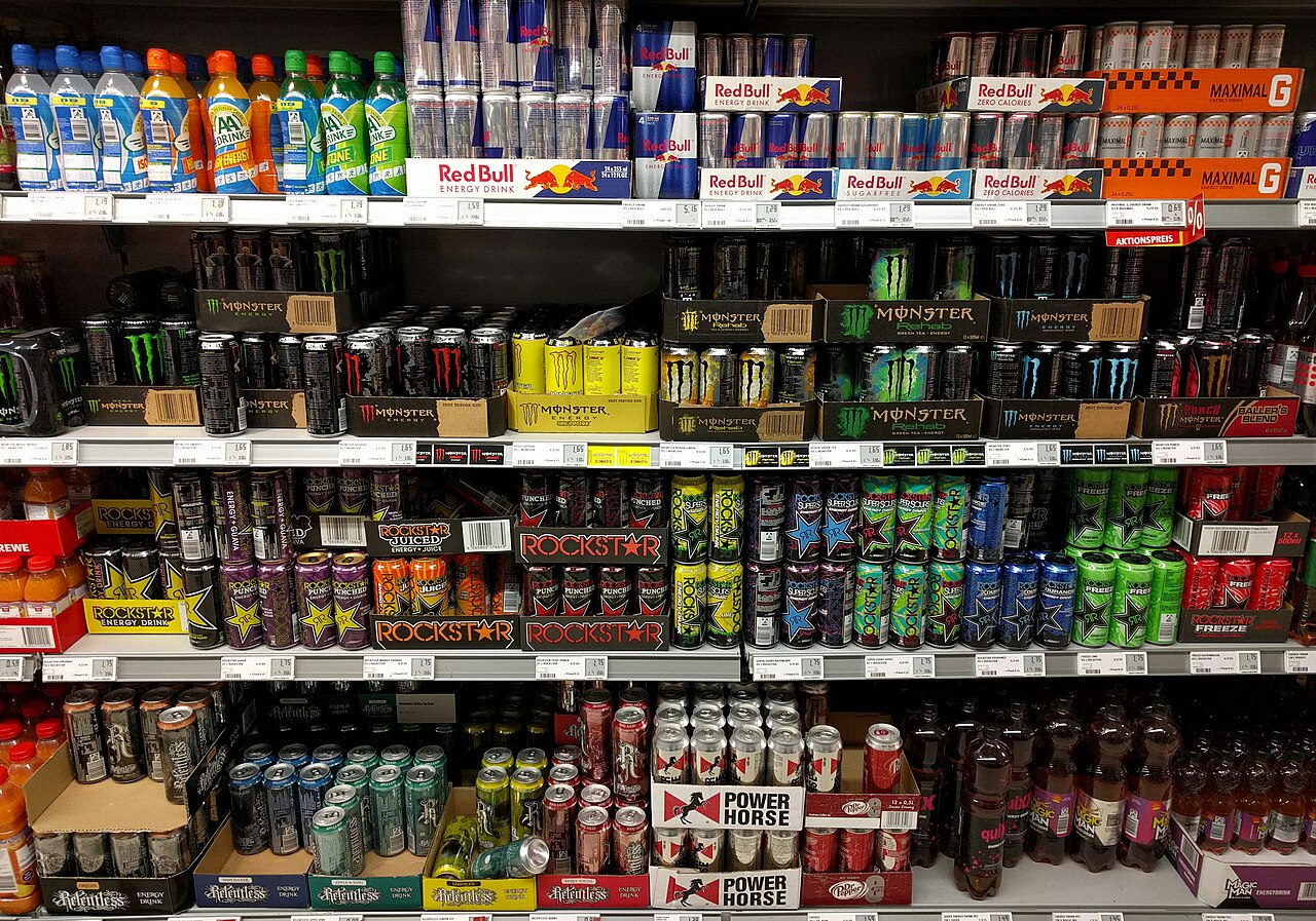 Chilled shelves of canned energy drinks in a German supermarket